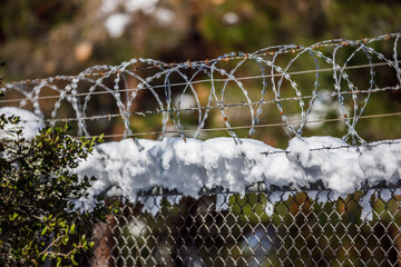 snow covered fence with wire