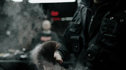 Barber cleaning clients neck with brush at barber shop in slow motion.