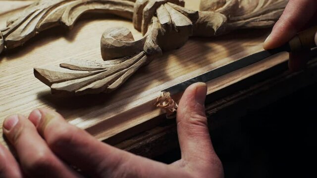 Close up of joiner working with wood frame slow motion