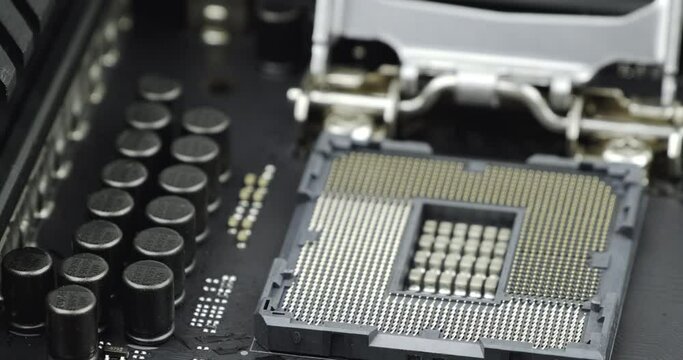 Truck shot of CPU Processor Socket. Circuit board with capacity, Computer Motherboard with electronic capacity components device