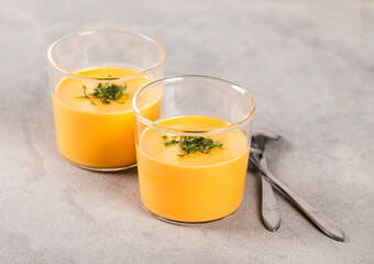 Vegan dessert Panna Cotta creamy carrot in a glass on a light gray background
