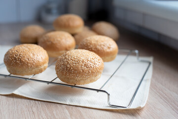 Sesame buns for hamburger in the kitchen, cooking at home.