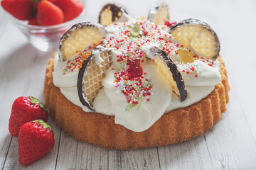 
photo of a baby cake with gummy bears and strawberries for birthday