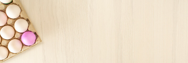 Colorful easter eggs on stand on wooden background