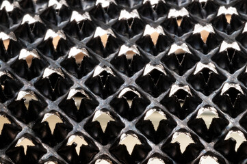 Fototapeta premium Metal knurled surface closeup view backlit