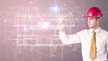 Handsome architect drawing with helmet