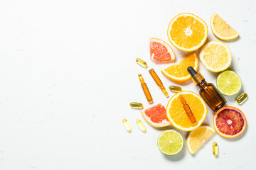 Vitamin C. Cosmetic products and fresh citrus fruits.