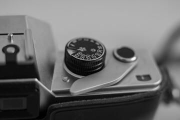 Antique film camera. Film rewind lever and shutter speed wheel on old camera. 