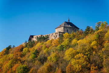 Obraz premium Scenic view of ancient ruins of gothic and renaissance medieval royal castle, autumn landscape, sunny day, fortresses on hill, stronghold Tocnik, Central Bohemia, Czech Republic