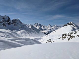 Panorama of the climber on the snow-capped mountain range. Ducan Glacier in Switzerland. Freeride in the mountains