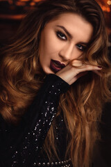 seductive portrait of red hair woman with dark lips and hand 