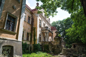 Fototapeta na wymiar Old palace of Archbishops in park. Obroshino village near Lviv city. Ukraine.