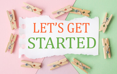 Lets Get Started. text on white notepad paper. on a colorful background.