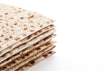 Jewish matzah isolated on white background. Jewish traditional Easter bread. Passover celebration symbol. Close-up