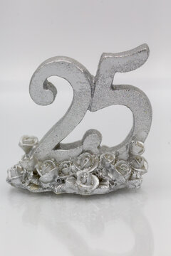 25th anniversary decoration for the silver wedding celebration with silver number in front of white background