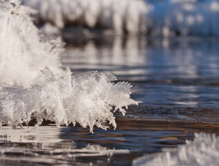 Ice crystals by flowing water close up.