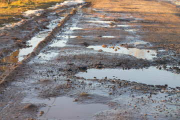 Country dirt road in the spring. Dirt on the road during the thaw.