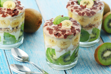 Trifle desserts with bananas, kiwi and yogurt