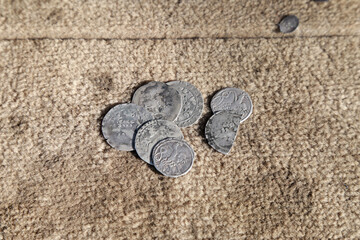 medieval silver european coins on rag background