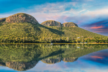 magaliesberg mountains view from hartbeespoort dam with blue sky