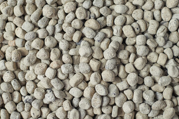 Texture of small porous gray stones