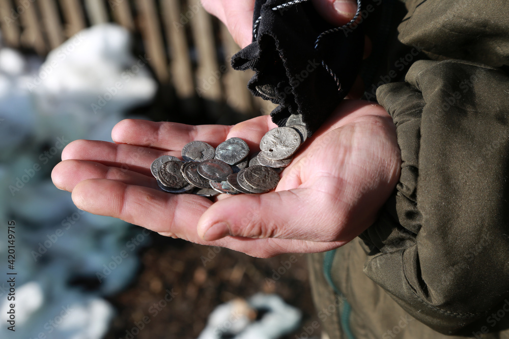 Wall mural ancient silver coins in hand