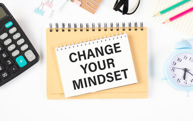 Change Your Mindset Text written on notebook page, red pencil on the right. Motivational Concept image