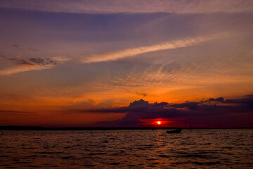 Naklejka na ściany i meble Beautiful landscape with sunset over lake Svityaz in Ukraine