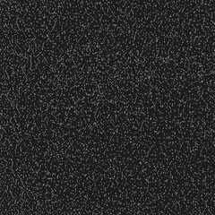 Abstract grainy grunge vector texture as seamless pattern with black background.