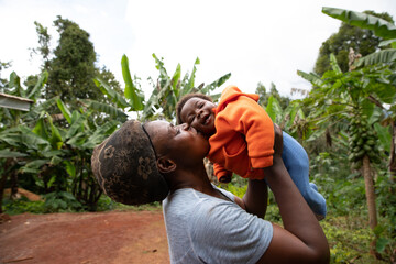 happy African mother kisses her newborn daughter. Mother's Day concept