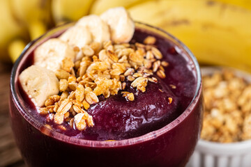 Açai with banana and granola. Brazilian acai.