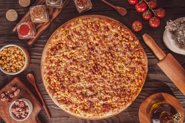 Pizza with mozzarela, corn, bacon and oregano (Milho com bacon) - Top view.