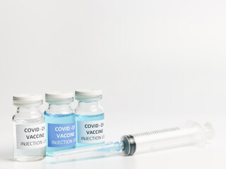 Selective focus COVID 19 VACCINES variant with syringe isolated on white background.  