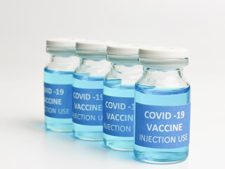 Selective focus a row of COVID 19 VACCINE isolated on white background.  