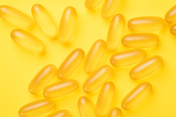 Omega 3 capsules on yellow background. Fish oil softgels. Supplement food vitamin D capsules. Top view - Image - 420162529
