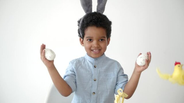 child coloring eggs on ester and having fun