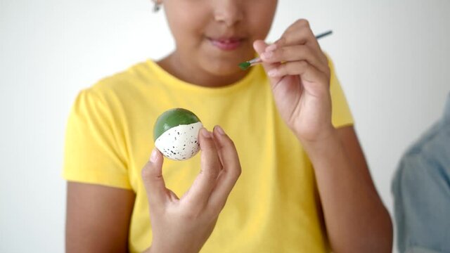 playing and coloring eggs for ester