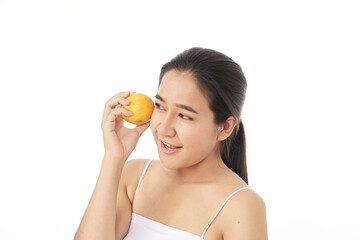 Obraz na płótnie Canvas women skincare image with orange on white