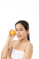 Obraz na płótnie Canvas women skincare image with orange on white