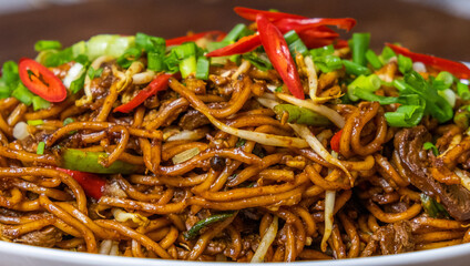 Malaysian popular dish stir fried noodles or locally known as Mee Goreng. Selective focus.