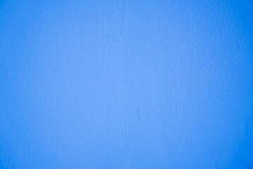 Blank light blue concrete wall for background.