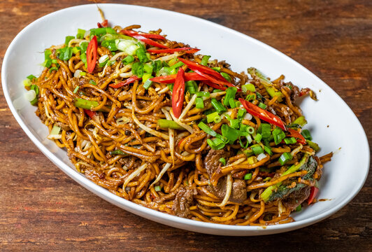 Malaysian popular dish stir fried noodles or locally known as Mee Goreng. Selective focus.