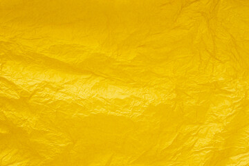 crumpled vivid yellow paper for background.