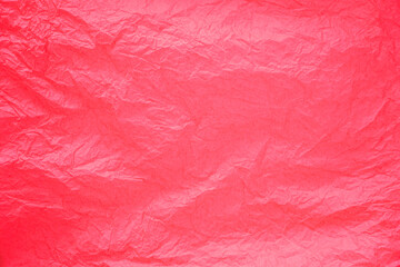 Surface of blank crumpled red plastic bag.