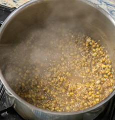 Boiling mung beans to make Malay delicacies or locally known as 