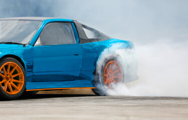 Race drift car burning tires on speed track © toa555