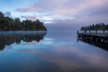 Morning fog over a beautiful lake. South Island, New Zealand.