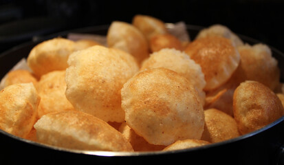 Closeup of homemade fried pani puri shells, Indian snack food