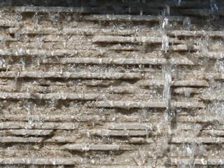 Water trickling down stone surface