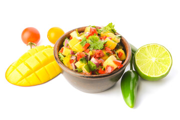 Bowl with fresh mango salsa on white background
